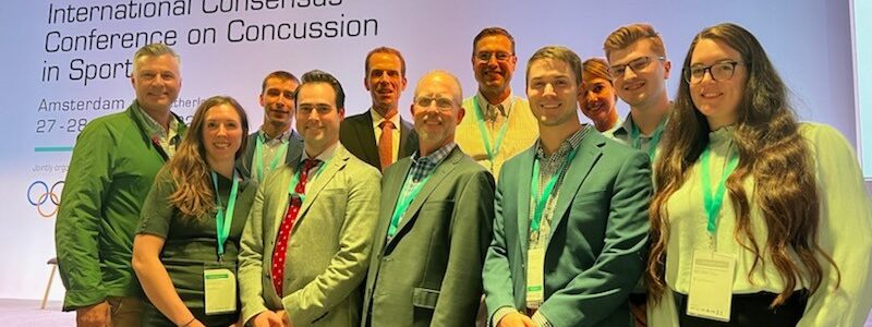 Concussion Center staff members taking a group photo during the International Consensus Conference on Concussion in Sport.